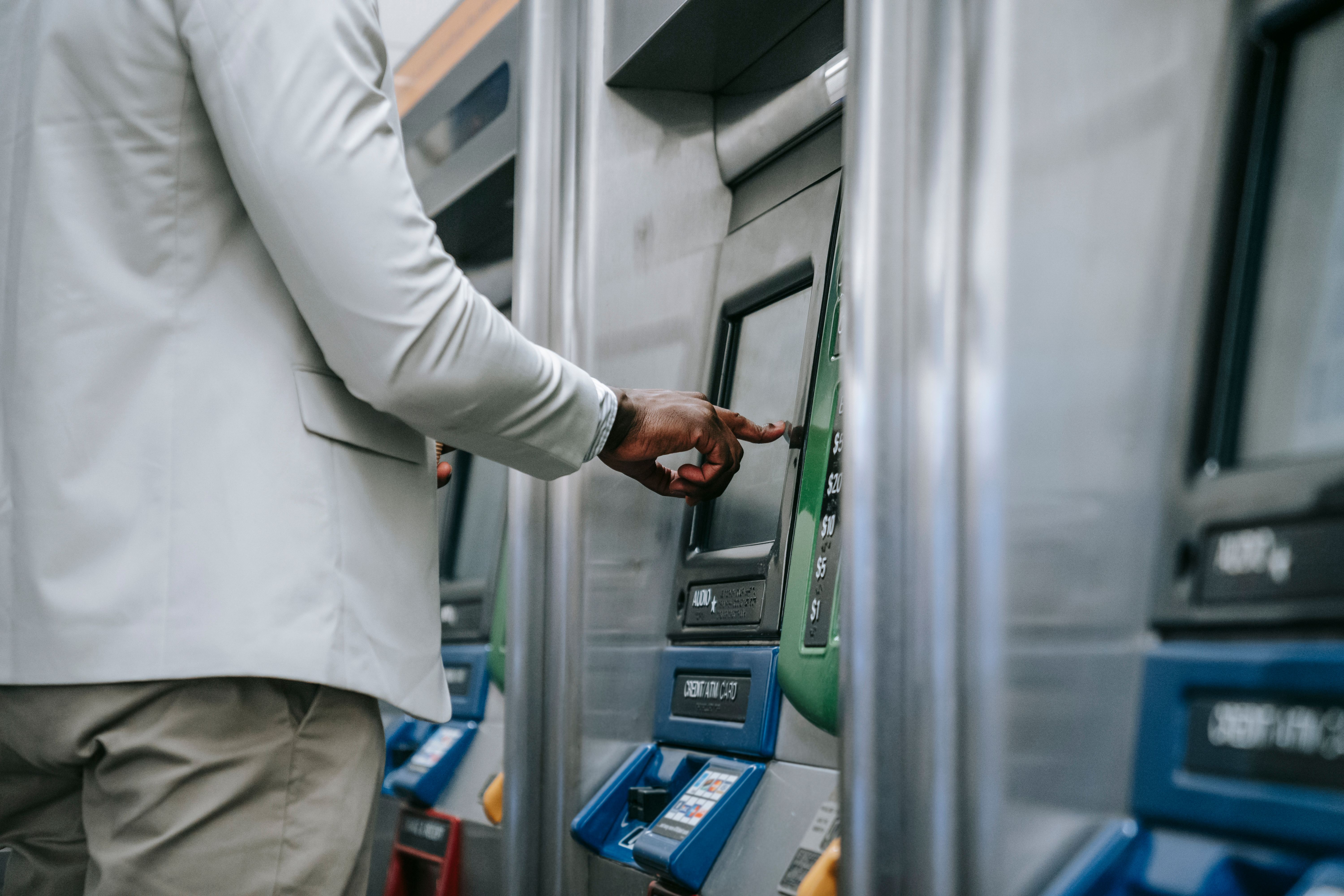 Customer withdrawing cash at a retail ATM